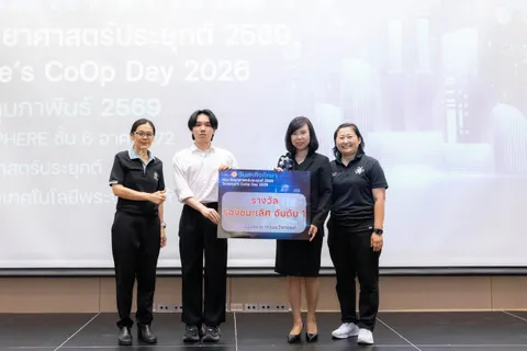 Ratchanon with faculty beside the first-runner-up oral presentation award board